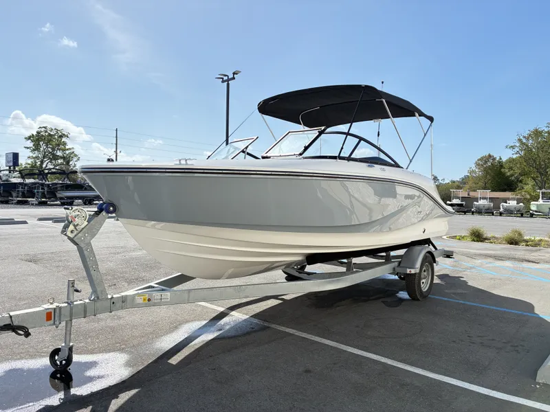 Slide: The Image of 2026 Bayliner V20 boat on trailer outdoors. - 6