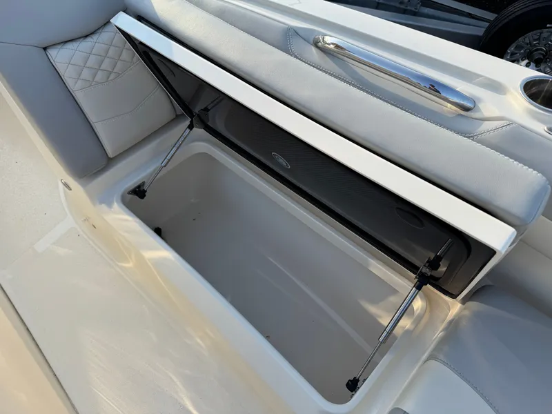 Slide: The Image of 2024 Scout 281 xss Carbon boat, open storage compartment. - 13