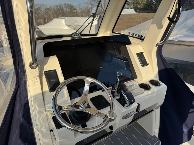 Slide: The Image of Interior view of 2024 Scout 281 xss Carbon boat cockpit. - 16