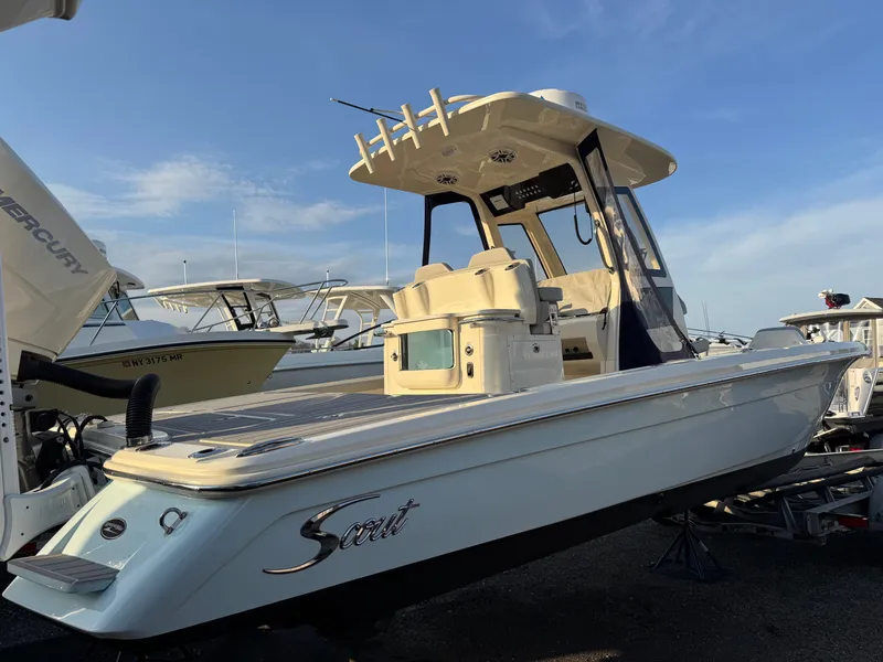 Slide: The Image of 2024 Scout 281 xss Carbon boat docked at sunset. - 3