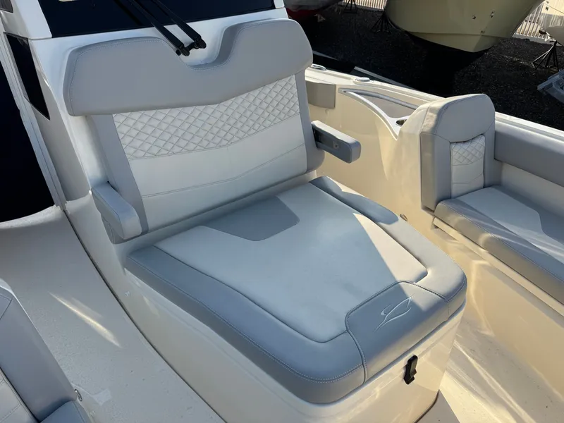 Slide: The Image of 2024 Scout 281 xss Carbon boat seat with gray upholstery. - 7