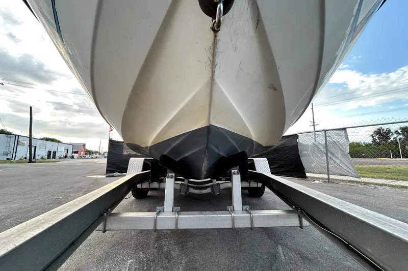 Slide: The Image of 1999 Hydra-Sports 2000 CC boat on trailer, viewed from below, outdoors. - 11