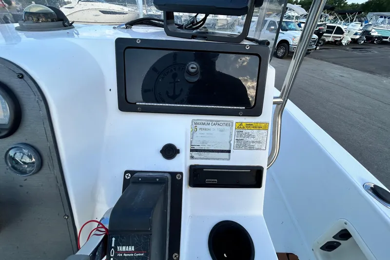 Slide: The Image of Console of a 1999 Hydra-Sports 2000 CC boat with Yamaha controls and capacity labels. - 22