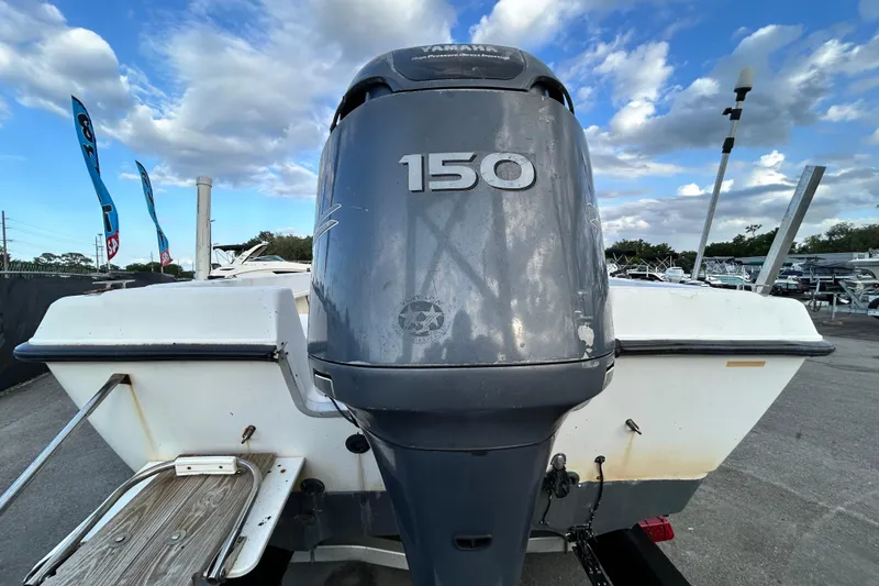 Slide: The Image of 1999 Hydra-Sports 2000 CC boat with Yamaha 150 outboard motor, parked outdoors. - 3