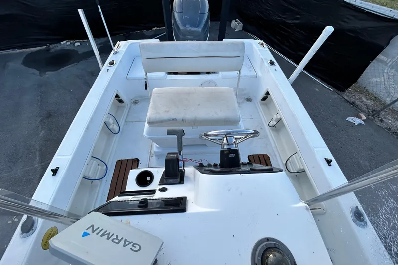 Slide: The Image of 1999 Hydra-Sports 2000 CC boat interior with steering wheel and Garmin navigation system. - 43