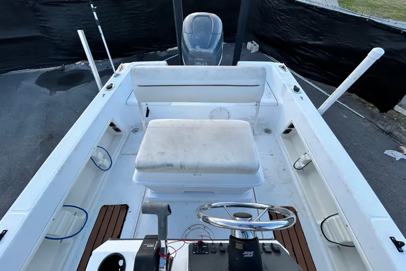 Slide: The Image of 1999 Hydra-Sports 2000 CC boat interior with steering wheel and seating. - 44