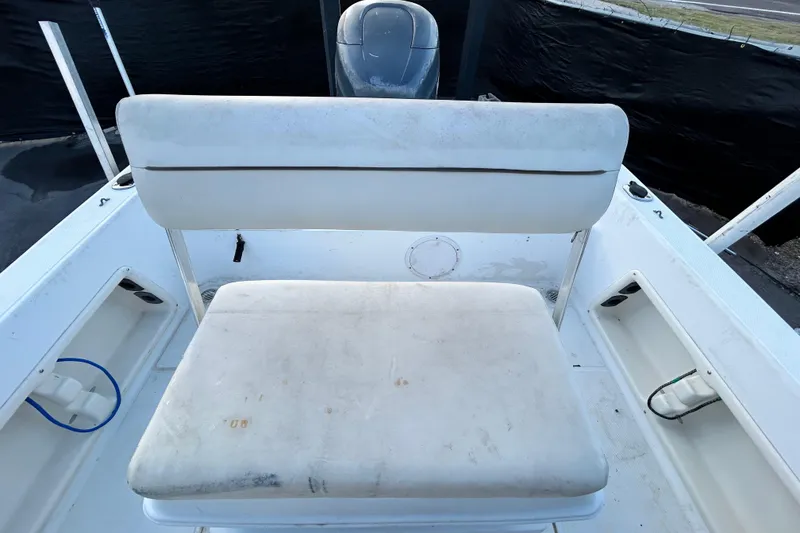 Slide: The Image of 1999 Hydra-Sports 2000 CC boat interior with white seating and storage compartments. - 45