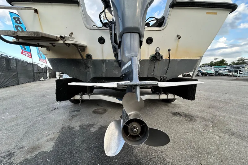 Slide: The Image of 1999 Hydra-Sports 2000 CC boat stern with visible propeller and motor on trailer. - 5