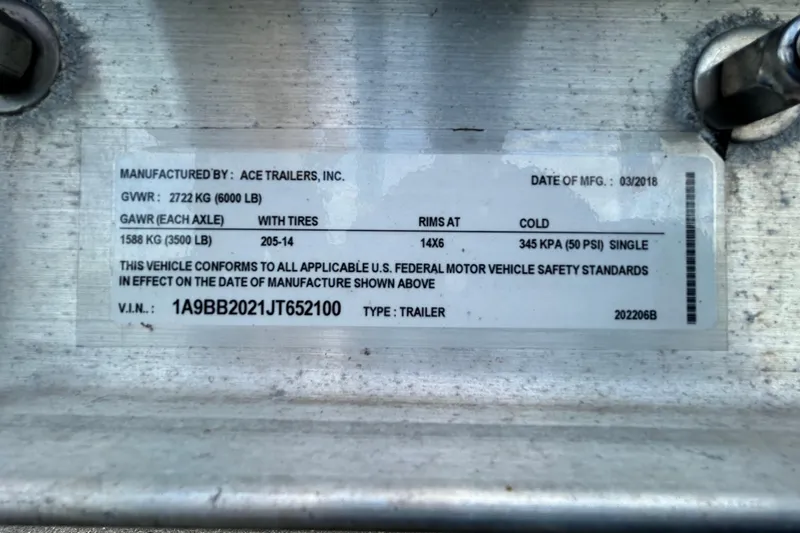 Slide: The Image of Label on Ace Trailers, Inc. trailer, manufactured March 2018, showing specifications and VIN. - 54