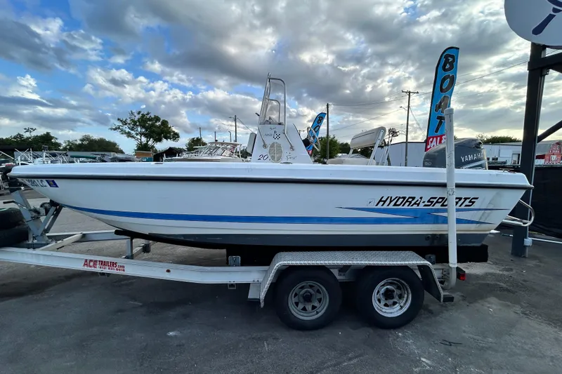 Slide: The Image of 1999 Hydra-Sports 2000 CC boat on trailer under cloudy sky. - 7