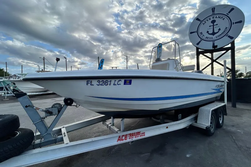Slide: The Image of 1999 Hydra-Sports 2000 CC boat on trailer under cloudy sky. - 8