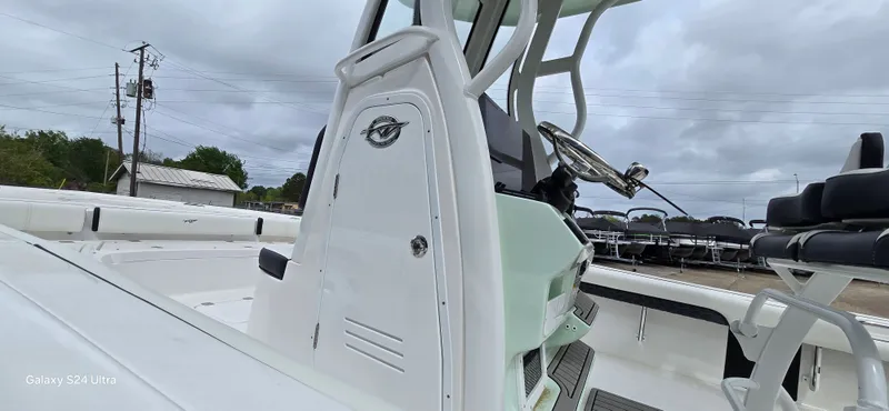 Slide: The Image of Tidewater 2500 Carolina Bay 2026, modern boat design, helm view. - 12