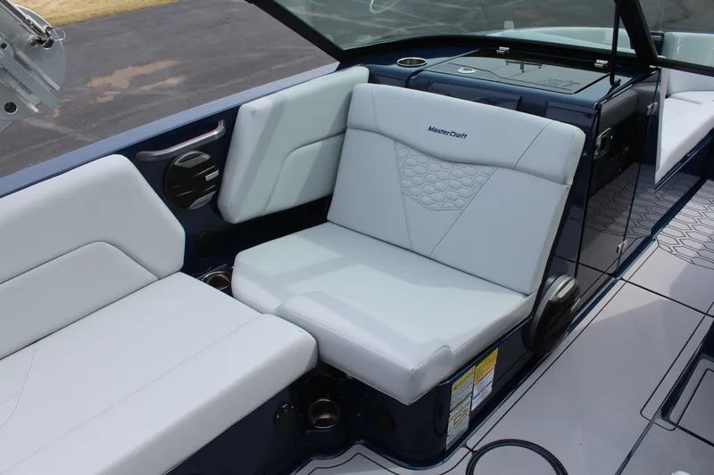 Slide: The Image of Interior of 2026 MasterCraft NXT23 with luxurious white seating. - 10