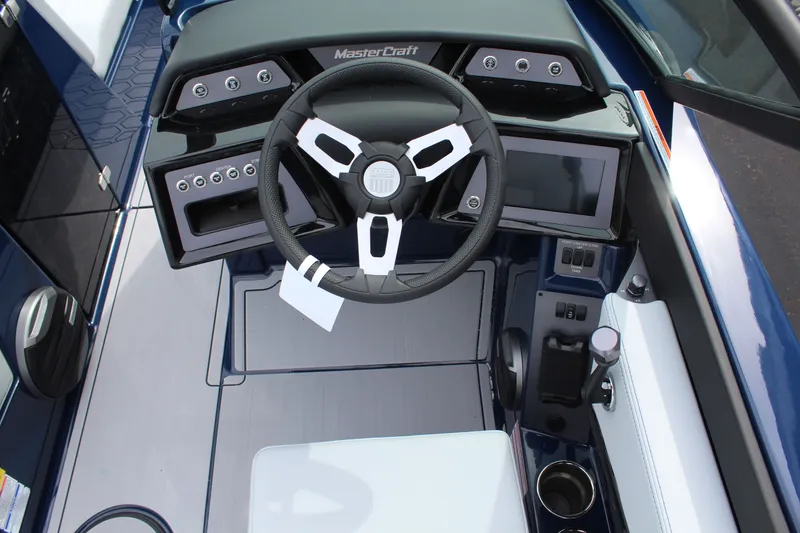 Slide: The Image of Interior of 2026 MasterCraft NXT23 with modern dashboard. - 12