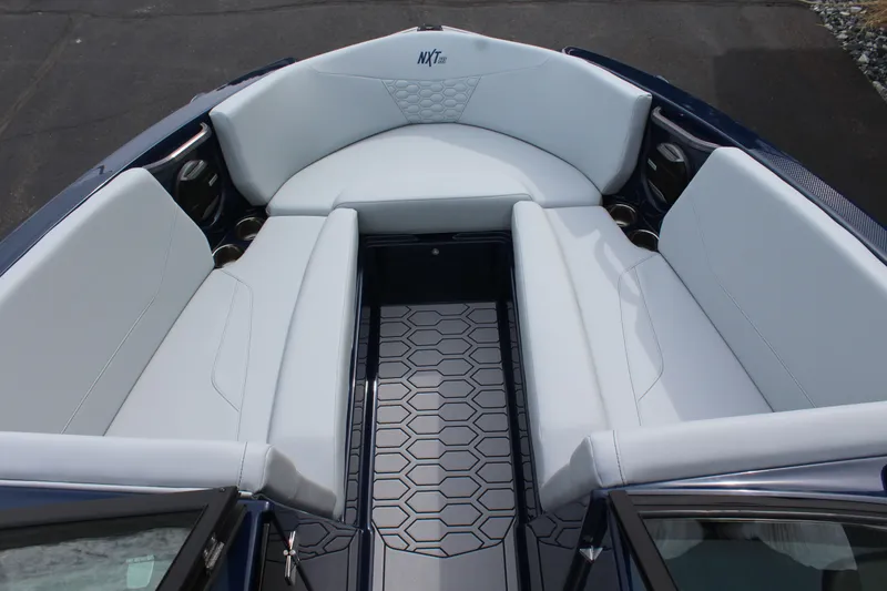 Slide: The Image of Interior of 2026 MasterCraft NXT23 boat with stylish seating. - 13