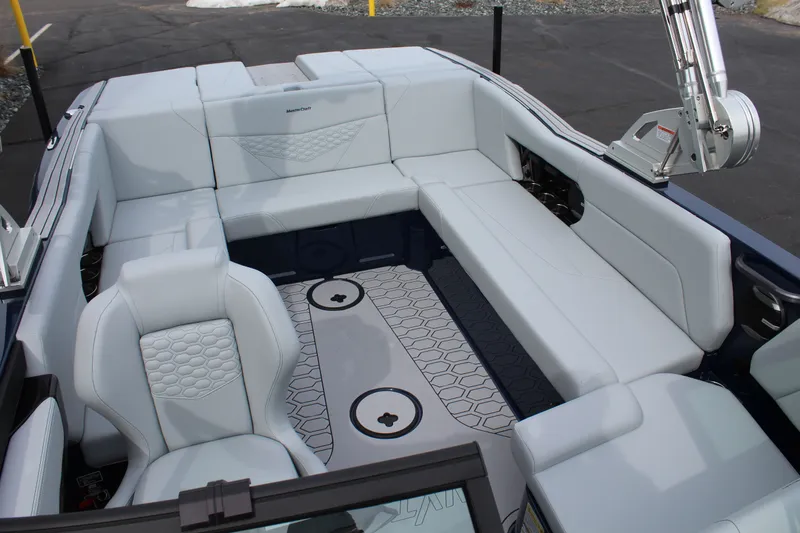 Slide: The Image of Interior of 2026 MasterCraft NXT23 with luxurious white seating. - 16