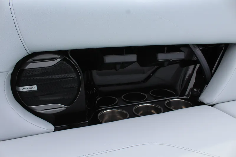 Slide: The Image of Interior of 2026 MasterCraft NXT23 with speaker and cup holders. - 18