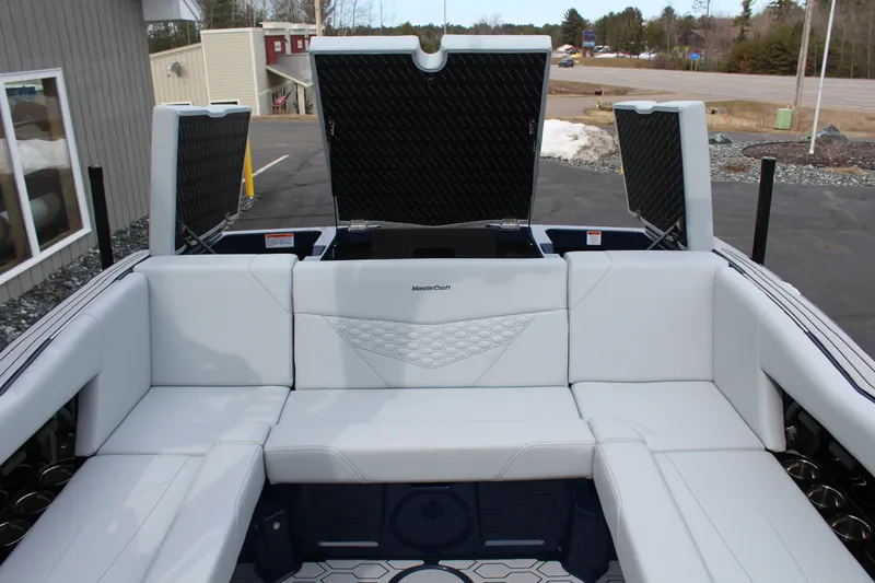 Slide: The Image of Interior of 2026 MasterCraft NXT23 boat with white upholstery. - 19
