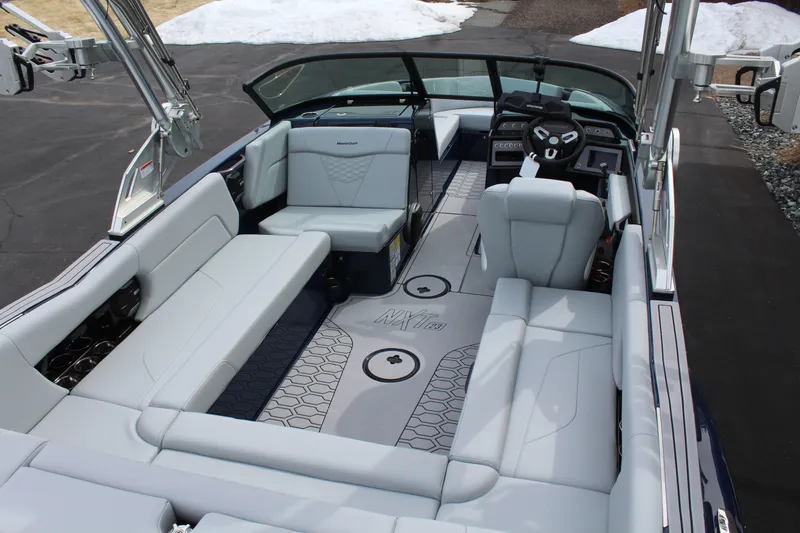 Slide: The Image of Interior of 2026 MasterCraft NXT23 with luxurious seating. - 7