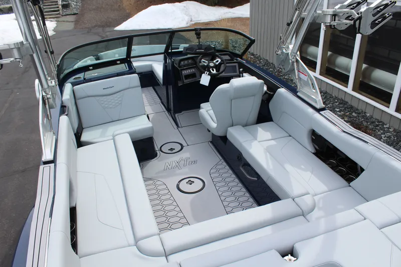 Slide: The Image of Interior of 2026 MasterCraft NXT23 with luxurious seating arrangement. - 8