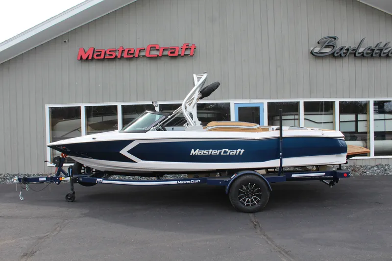 The Image of 2026 MasterCraft ProStar boat parked in front of a building. - 1