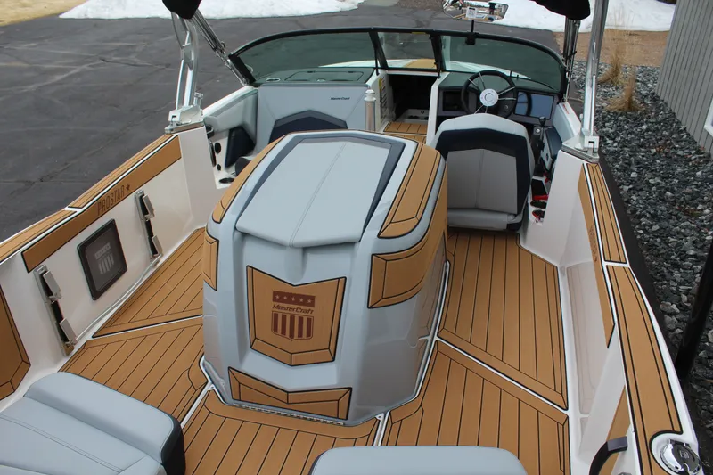 Slide: The Image of Interior of a 2026 MasterCraft ProStar boat with stylish design. - 11