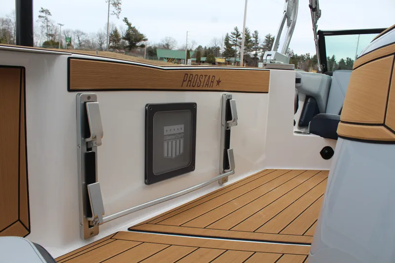 Slide: The Image of 2026 MasterCraft ProStar boat interior with wood paneling. - 13