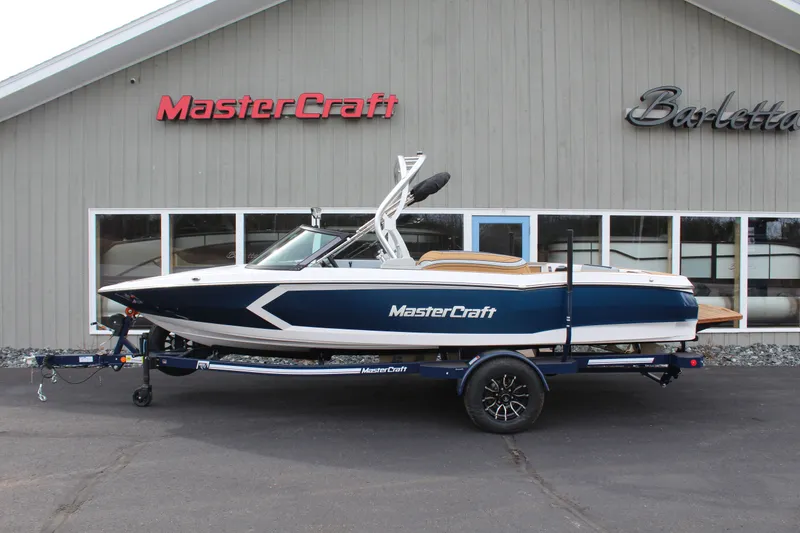 Slide: The Image of 2026 MasterCraft ProStar boat in front of a building. - 4