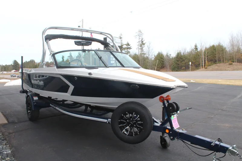 Slide: The Image of 2026 MasterCraft ProStar boat on trailer, ready for adventure. - 7