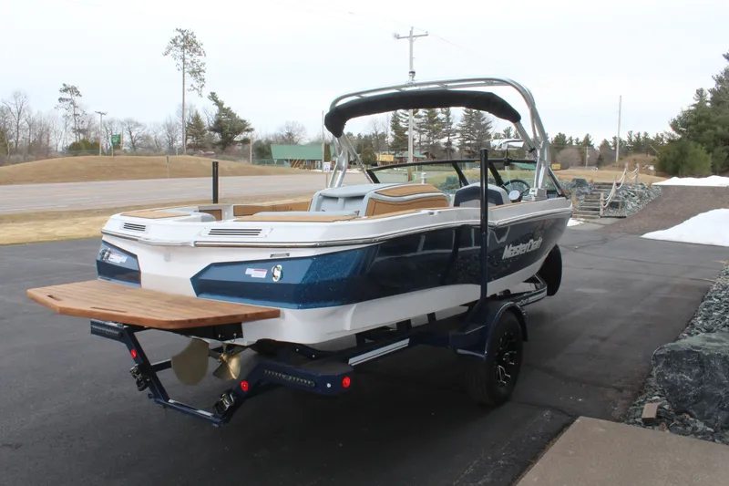 Slide: The Image of 2026 MasterCraft ProStar boat on trailer, ready for adventure. - 8