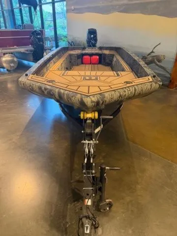 Slide: The Image of 2026 Grizzly G1650T DB boat on trailer in showroom. - 4