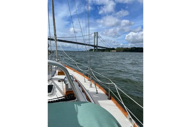 Slide: The Image of 1983 Bristol 38.8 sailboat docked with inflatable dinghy alongside. - 14