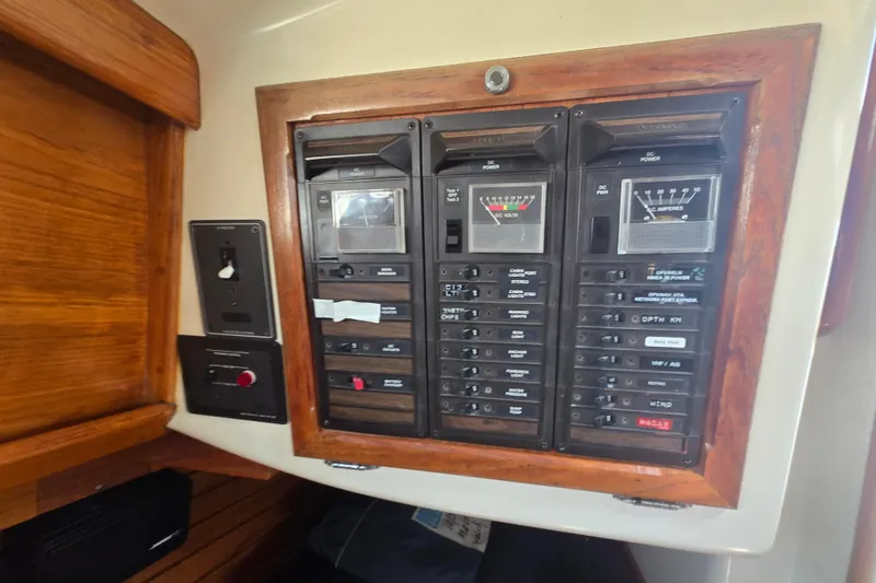 Slide: The Image of Electrical panel on a 1983 Bristol 38.8 sailboat, featuring gauges and switches. - 23