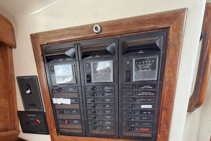 Slide: The Image of Electrical control panel on a 1983 Bristol 38.8 yacht, featuring switches and meters. - 37
