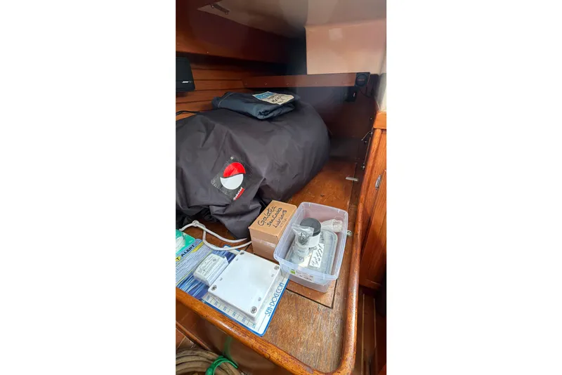 Slide: The Image of Interior of 1983 Bristol 38.8 sailboat with storage items and wooden cabinetry. - 41
