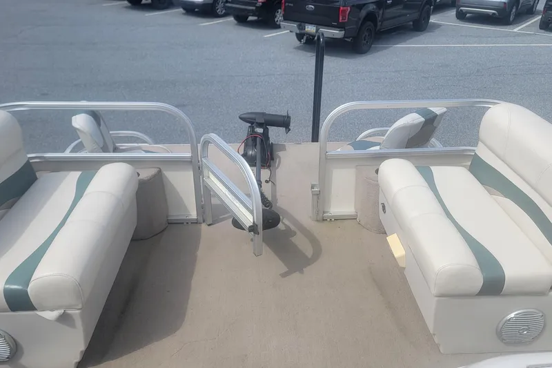 Slide: The Image of 2011 Sun Tracker Party Barge 20 Classic Series interior with seating and steering wheel. - 10