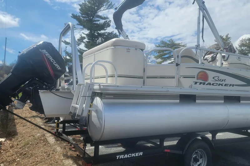 Slide: The Image of 2011 Sun Tracker Party Barge 20 Classic Series pontoon boat on trailer. - 2