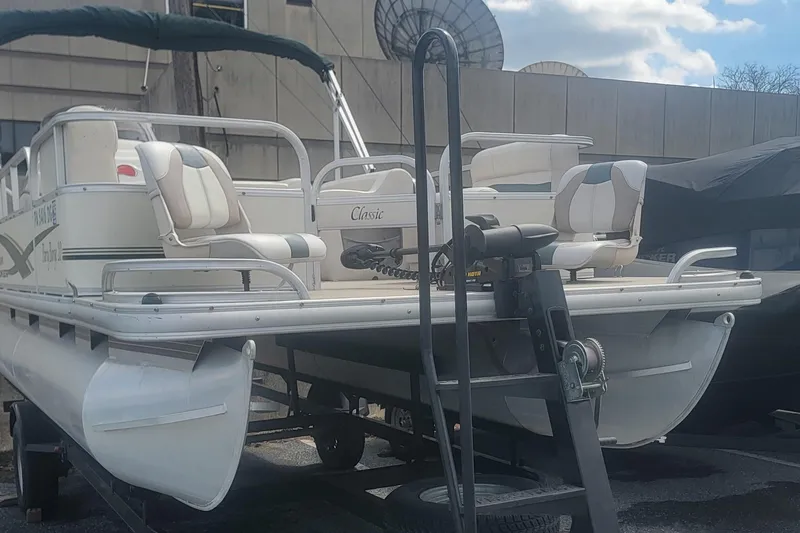 Slide: The Image of 2011 Sun Tracker Party Barge 20 Classic Series pontoon boat on trailer. - 3