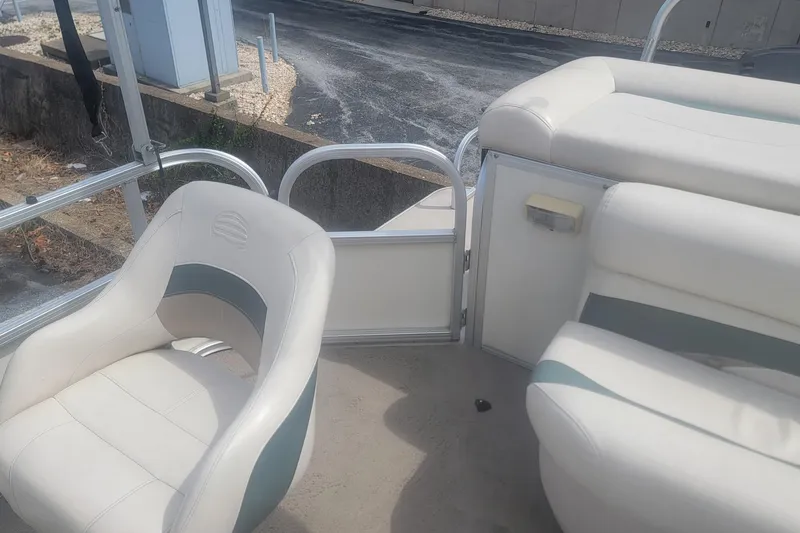 Slide: The Image of 2011 Sun Tracker Party Barge 20 Classic Series interior with white seating and open gate. - 5