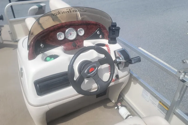Slide: The Image of Steering console of a 2011 Sun Tracker Party Barge 20 Classic Series pontoon boat. - 6