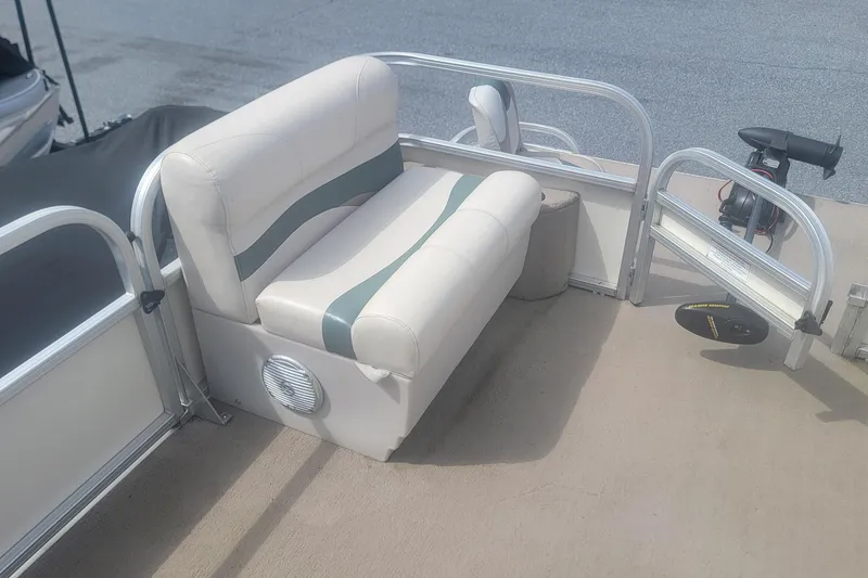 Slide: The Image of 2011 Sun Tracker Party Barge 20 Classic Series boat seating area with speaker. - 8