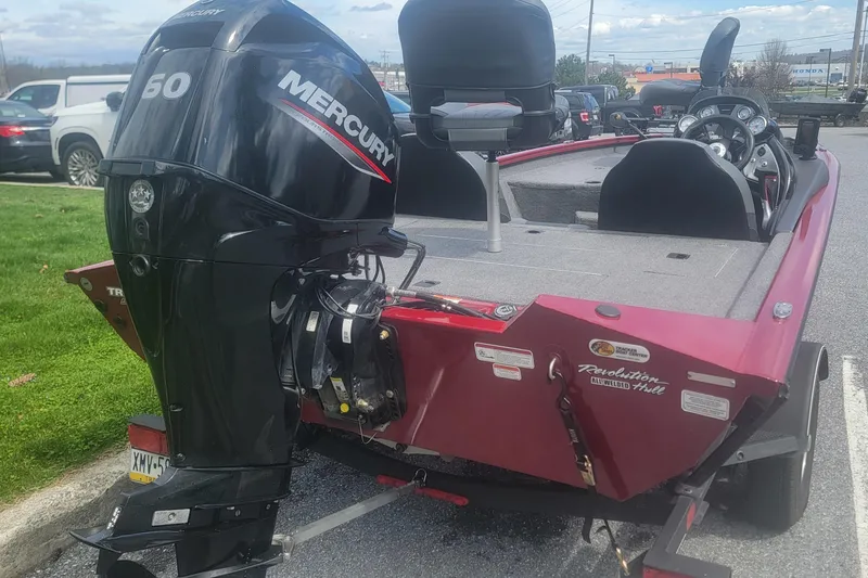 Slide: The Image of 2021 Tracker Pro Team 175 TXW boat with Mercury 50 HP engine, parked outdoors. - 3