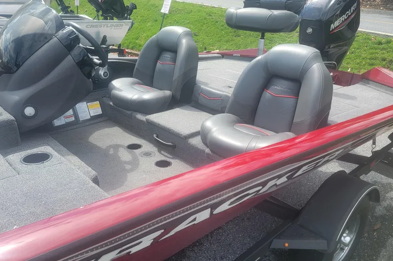 Slide: The Image of 2021 Tracker Pro Team 175 TXW boat interior with gray seats and red accents. - 8