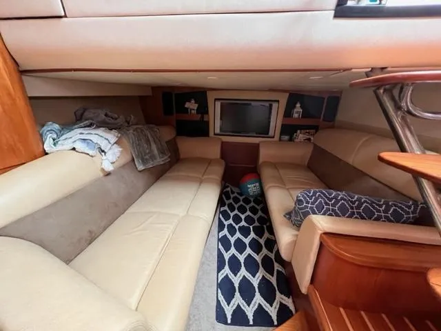 Slide: The Image of Interior of 2008 Tiara Yachts 3900 Sovran with beige seating and TV. - 23