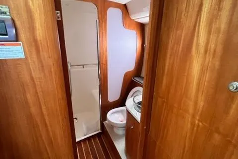Slide: The Image of 2008 Tiara Yachts 3900 Sovran bathroom with wooden interior and modern fixtures. - 24