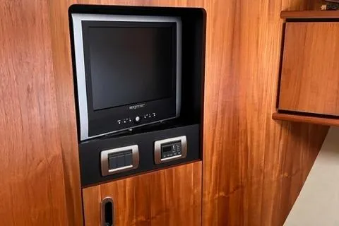 Slide: The Image of Built-in TV and control panel in 2008 Tiara Yachts 3900 Sovran interior. - 25