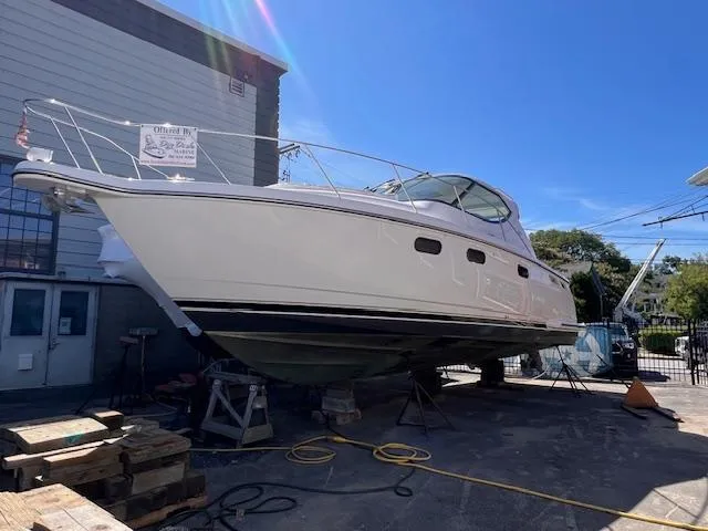 Slide: The Image of 2008 Tiara Yachts 3900 Sovran on dry dock, white hull, outdoor setting. - 3