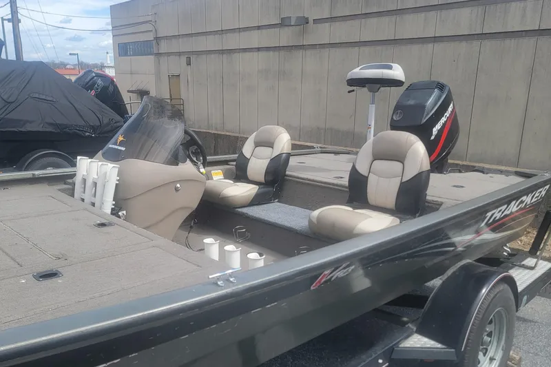 Slide: The Image of 2008 Tracker Tournament V-18 fishing boat with seating and Mercury outboard motor. - 7