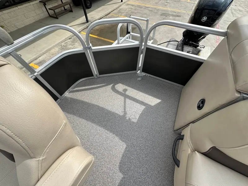 Slide: The Image of Interior of a 2017 Tracker 20 DLX pontoon boat. - 11