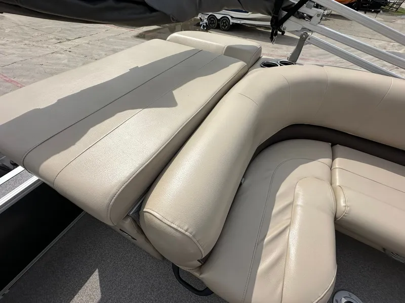 Slide: The Image of Beige leather seating on a 2017 Tracker 20 DLX boat. - 12